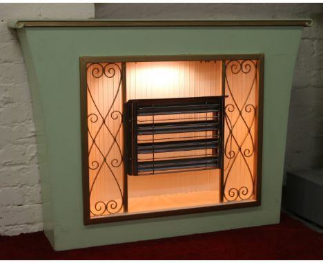 A retro four bar electric fire and surround with multi coloured lighting c1970.