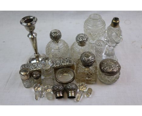 Silver topped glass dressing table bottles; Silver tapered candlestick, makers mark indistinct, London 1923; silver backed br