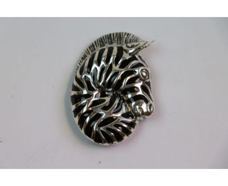 Silver and enamel brooch in the form of a zebra's head