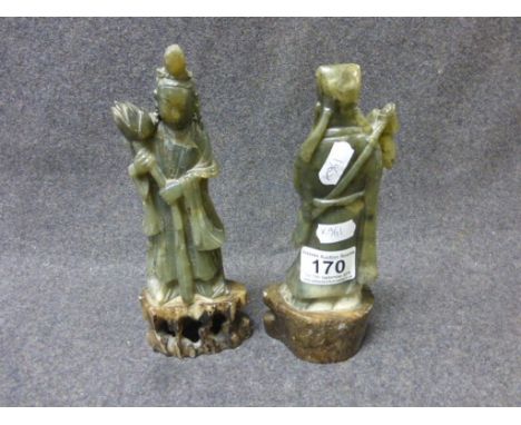 Two carved hardstone jade type Oriental figurines, one depicting a woman holding a lotus flower, raised on carved hardstone p