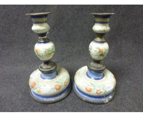 A pair of 19th century Continental enamel and white metal candlesticks of knopped form, floral and leaf decoration to enamel 