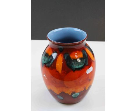 Poole Pottery vase in bright Orange & Red colours and pale Blue interior