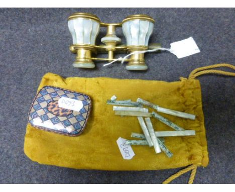 Pair of late Victorian mother-of-pearl opera glasses with folding handle together with a small tin of loose mother-of-pearl p