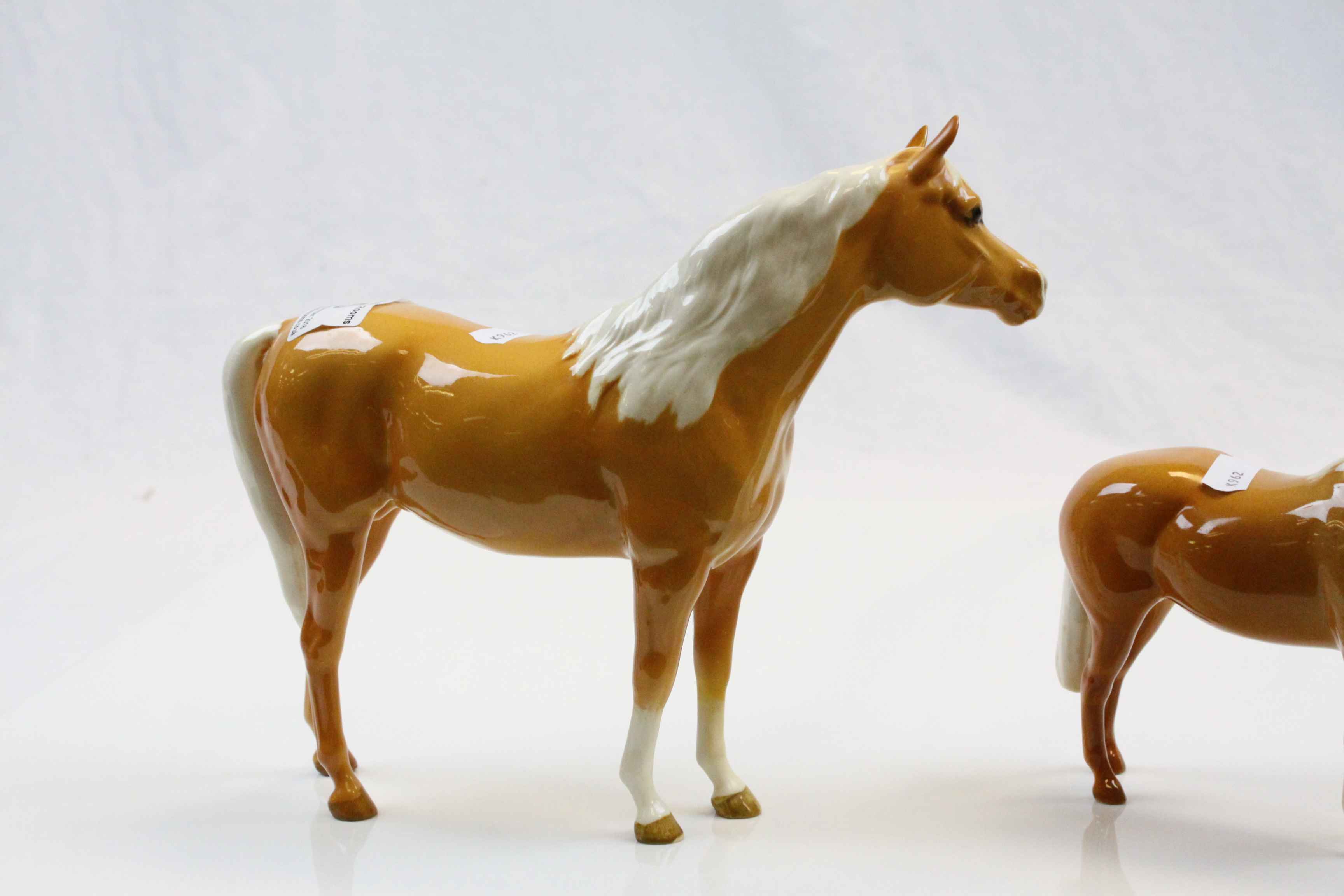 Two Beswick Palomino Horses of different sizes