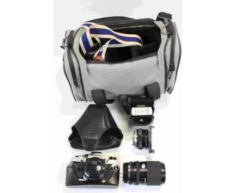 Olympus OM10 Camera together with Various Lenses and Accessories contained in a Soft Camera Bag