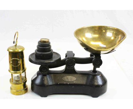 A set of vintage scales and weights and a reproduction miners lamp.