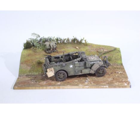 Tamiya - A WWII diorama created using Tamiya a 1:35 scale model kit, this battle scene constructed on a wooden base features 