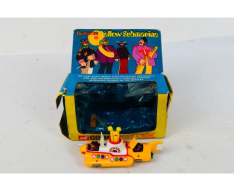 Corgi Toys - A boxed Corgi Toys #803 'The Beatles Yellow Submarine'. The model which features a yellow hatch to rear and whit