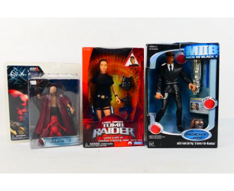 Hasbro, Mezco Toyz, Playmates - 3 x boxed figures - Lot includes a Hellboy 'Rasputin' figure. A Lara Croft Tomb Raider In Com