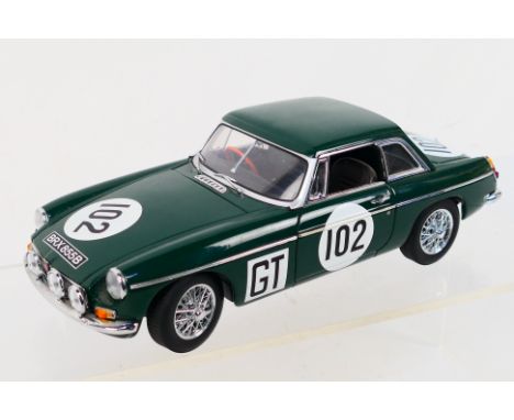 Autoart - An unboxed 1/18 scale 1967 MGB GT MK2 race car in dark green livery - The #86781 die-cast model appears to be in ve