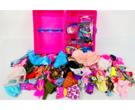Mattel - Barbie - An unboxed Barbie Doll fashion Doll Trunk, with a large quantity of Barbie related clothing and some access