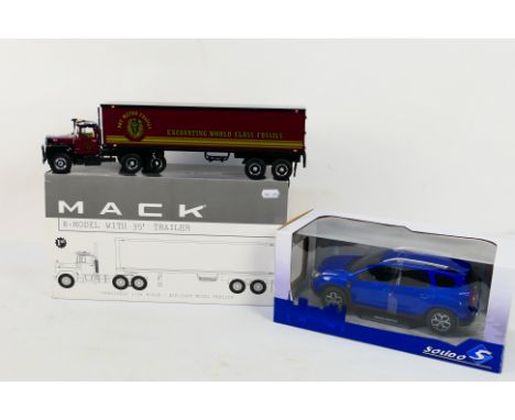 Solido - 1st Gear - 2 x boxed models a Dacia Duster Mk2 in Cosmos Blue in 1:18 scale # S1804604 and a Mack R Model tractor un