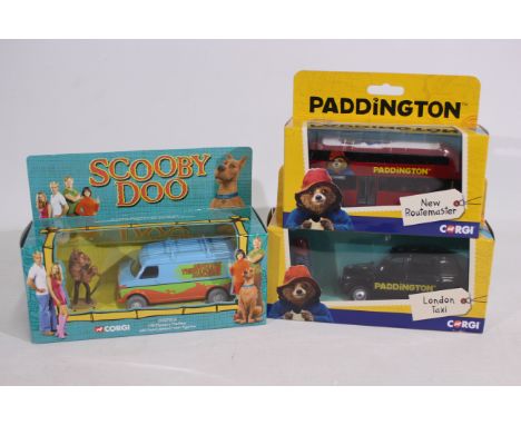 Corgi - 3 x boxed TV related vehicles, Scooby Doo's Mystery Machine # CC87503, a Paddington London Taxi # CC85925 and a Paddi