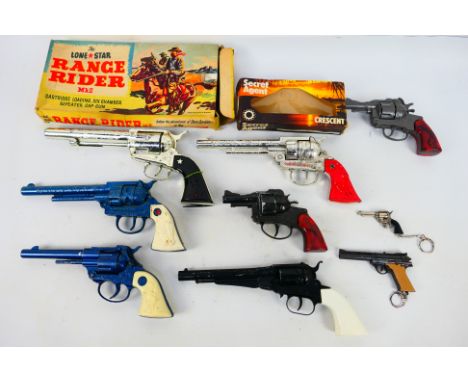 Crescent - Lone Star - A collection of vintage cap guns including a boxed Range Rider MkII, a boxed Secret Agent, a blue and 