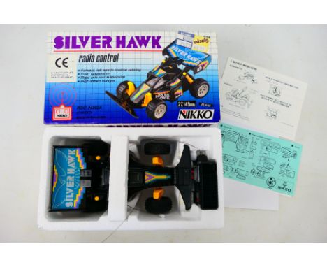 Nikko - A boxed Nikko Silver Hawk Radio Controlled car - The R/C car in 1/24 scale comes with instruction manual. Car is pres