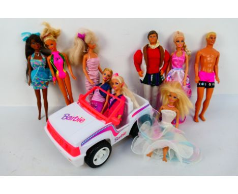 Mattel - Barbie - An unboxed Barbie Jeep, together with a group of nine unboxed Barbie dolls. Items show some play wear gener