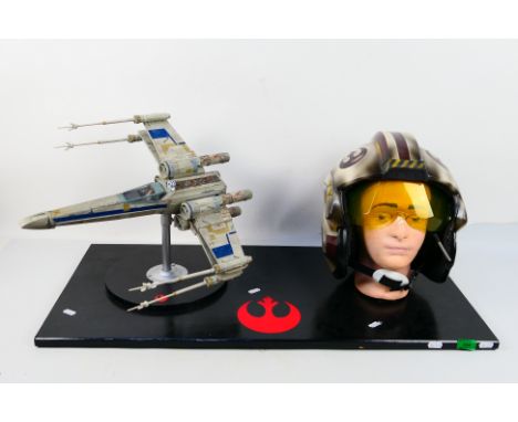 Star Wars - A large decorative display piece which contains a Star Wars Rogue One Blue Leader X-Wing Fighter mounted on a sta