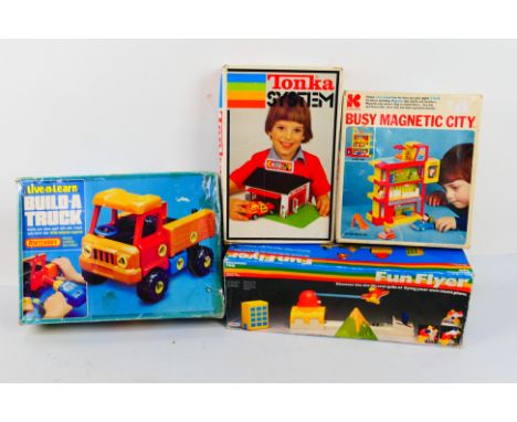 Palitoy - Matchbox - Tonka - Kohner - Four boxed vintage toys. Lot consists of Matchbox 'Live & Learn' Build-a-Truck; Palitoy