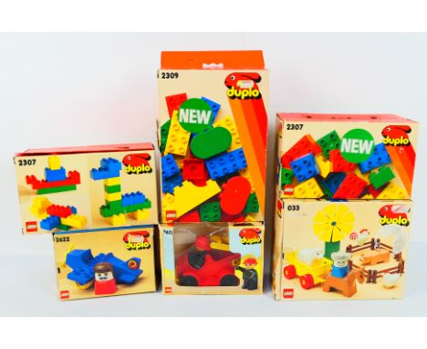 Lego Duplo - A boxed collection of vintage Lego Duplo sets / toy. Lot includes Duplo #2611 Fire Engine; #033 Farm Animals; #2
