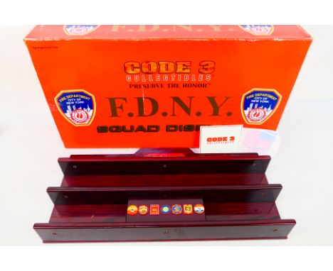 Code 3 Collectibles - A boxed #13958 F.D.N.Y Squad Display wooden stand - Wooden stand appears in good condition. Box appears