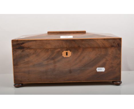 Regency mahogany sarcophagus shaped tea caddy, blond wood interior with two compartments, width 33cm.