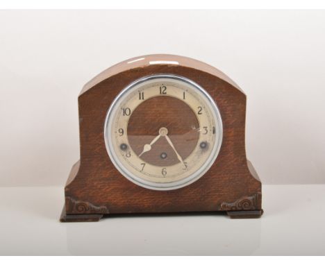 German gilt metal anniversary clock, silvered dial signed Diana, under a glass dome, 30cm and an oak cased mantel clock, Garr