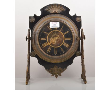 American style ebonised and metal mounted mantel clock, visible escapement, scrolled trestle ends, 35cm.
