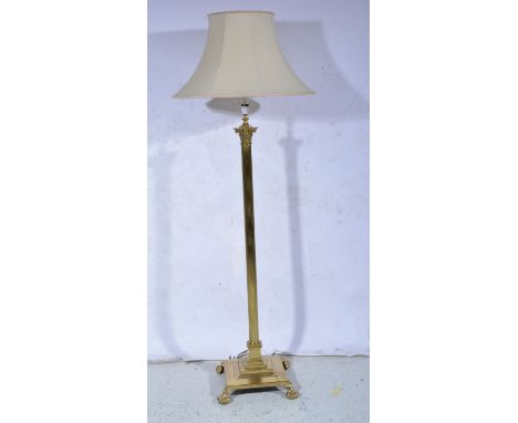 Brass Corinthian column standard lamp, fluted shaft, square base, lion paw feet, complete with shade 175cm overall.