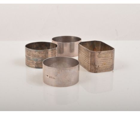 Rectangular sterling silver napkin ring, engine turned, engraved initials and three other napkin rings, (4).