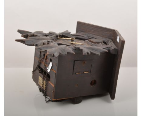 Carved wood cuckoo clock, double weight driven movement, case 27cm.
