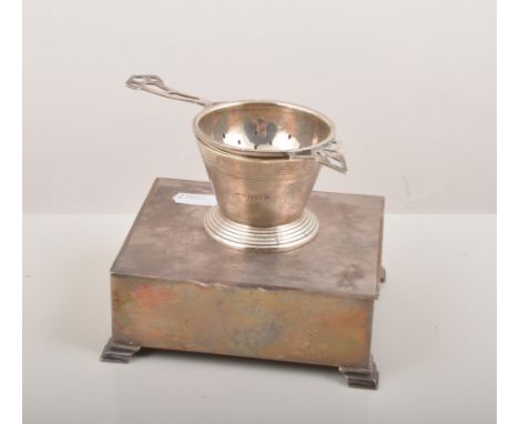 Silver cigarette box, Birmingham 1964, engine turned, ogee bracket feet, width 13cm, a small silver box and a silver tea stra