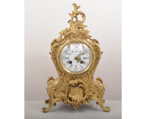 French style gilt metal three piece clock garniture, in Louis XV style and a balloon shape clock with white enamel dial, cyli