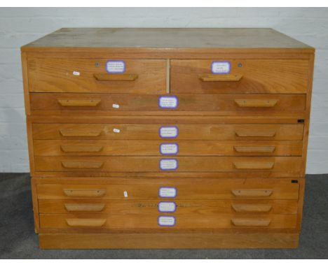 Light oak plan chest in three sections, fitted with nine drawers, 116cm x 88cm.
