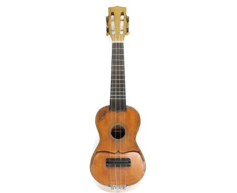 Gelas Model ukulele, by and signed on the table Gelas, with an angled two piece spruce table and open peg box, 21.75" long ov