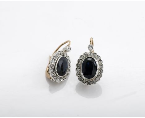 A pair of earrings, 800/1000 gold and platinum, set with 2 oval-cut sapphires and 38 antique brilliant-cut diamonds weighing 