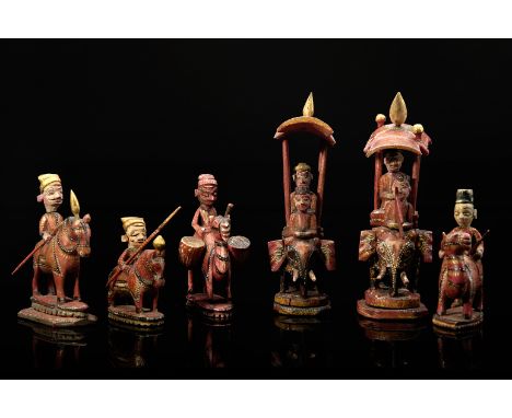 Six chess pieces - red King and Queen, bishops and knights, carved, painted and gilt ivory, Indian - Rajasthan, 19th C., vari