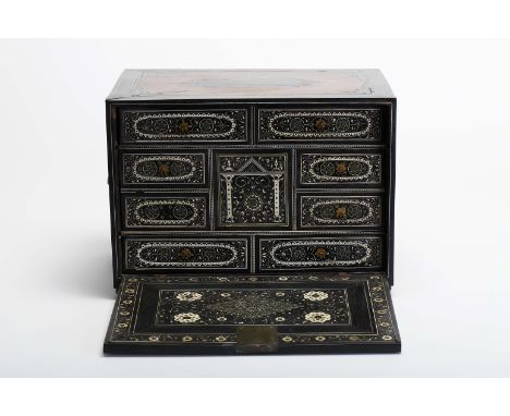 A bureau, teak, partial ebony covering, ebony inlays with ivory fillets with Islamic contours, interior of the cover and fron