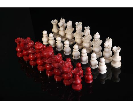 Chess Pieces - Ottoman Army vs European Army, carved ivory, one of the sets dyed red, horse eyes made of glass, French, 19th 