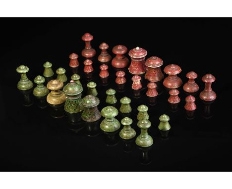 Chess pieces, carved ivory, one set dyed green, the other red, Indian (islamic), 19th C., minor faults, small restoration, we