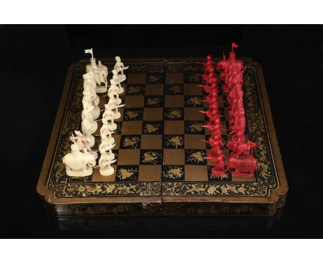 Chess Pieces - English Army against Chinese Army and hinged board closing in the shape of a box, carved ivory, one of the set