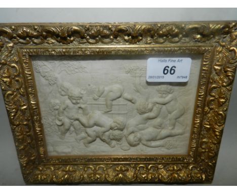 A rectangular framed white plaque, moulded in relief with an assortment of putto playing within a garden setting*