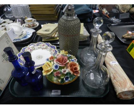 A pair of glass decanters and stoppers, a soda syphon, a ceramic horn, a pair of blue glass bottles with stoppers, etc.