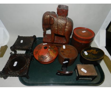 A group of Chinese and Japanese boxes of various forms and designs, along with a pair of Chinese hardwood stands and a candle