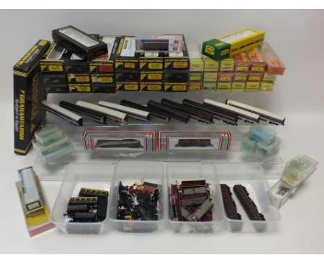 A group of miscellaneous N gauge items, to include a quantity of spare bogies and parts for locos, various unboxed carriages,