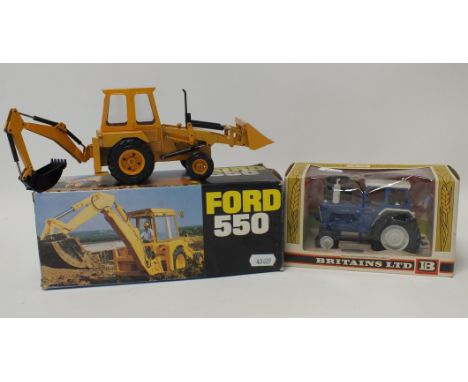 Two boxed model tractors; a Britians Ford E600 tractor with cab and driver in window display box, circa 1978 and a Ford 550 d