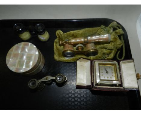 A cased mother of pearl mounted travelling clock, together with a mother of pearl mounted dressing table jar and three pairs 