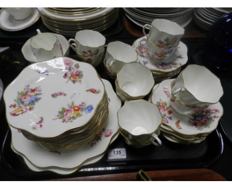 A Coalport part tea service with floral design, to include milk jug, sugar bowl, cups and saucers, etc.