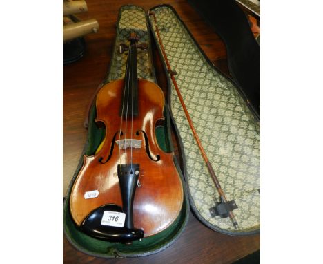 A violin bearing Stradivarius label and a stringless bow cased.