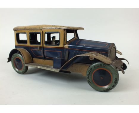A tinplate model of a six light saloon car attributed to Tipp and Co, Germany, circa 1933, the model in blue and fawn with wo