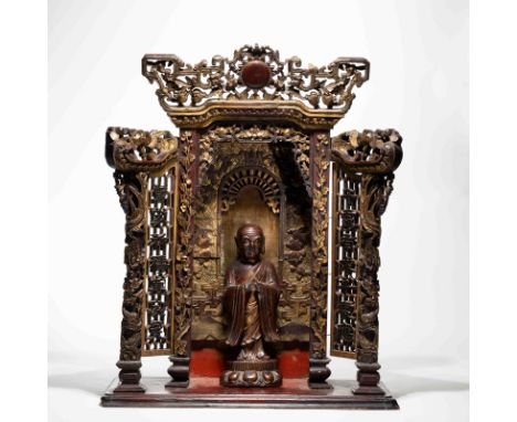 A CHINESE GILT-LACQUERED WOOD ARHAT (LUOHAN) AND NICHE, MING DYNASTY； Please note: in-house shipping cannot be arranged for t